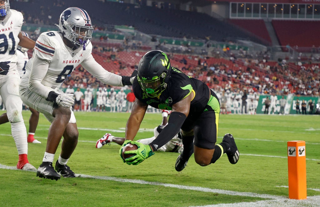 Jaren Mangham #0 of the South Florida Bulls scores a touchdown during a game against the Howard Bison.
