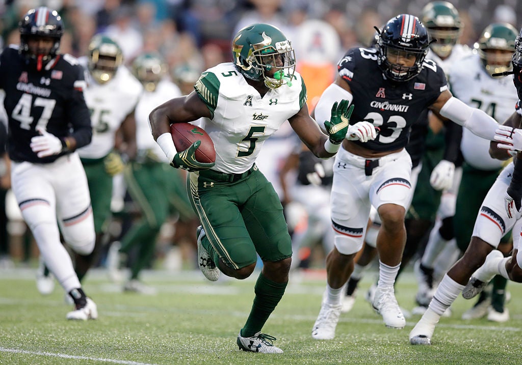Marlon Mack #5 of the South Florida Bulls runs with the ball during a game.