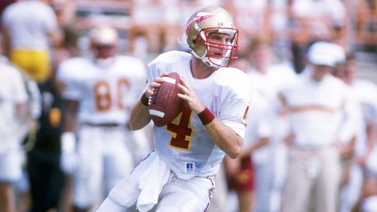 Quarterback Peter Tom Willis of the Florida State Seminoles drops back to pass during a game, circa 1989.