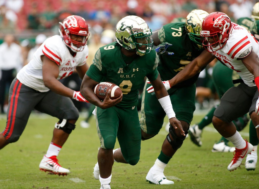 Quarterback Quinton Flowers #9 of the South Florida Bulls runs during a game against the Houston Cougars.